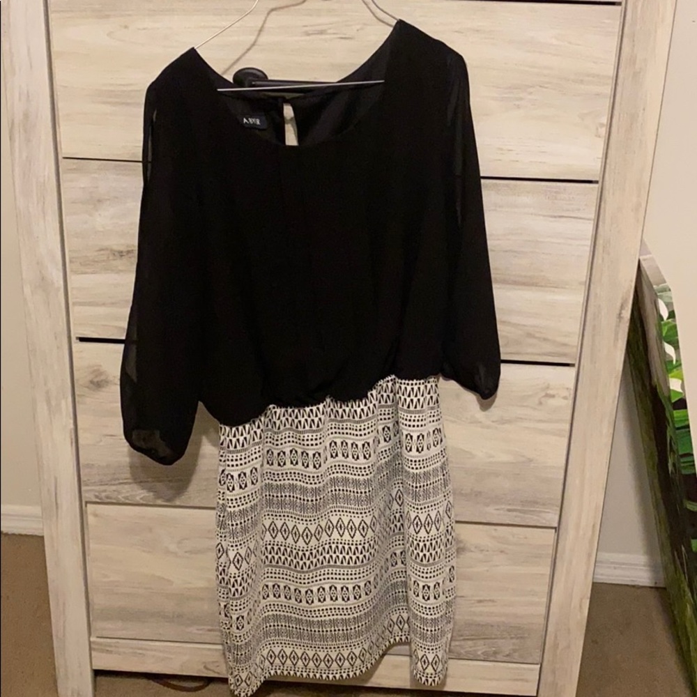 Cute dress. Is more fitting around the waist